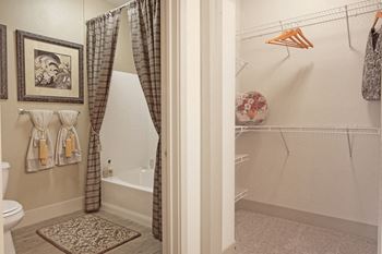 Separate shower room next to large walk-in closet